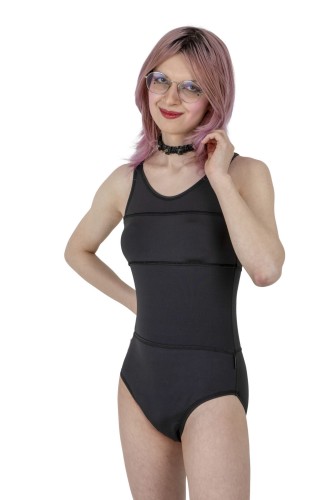 Model wearing black one-piece swimsuit for trans women, front view