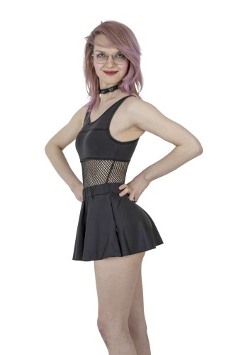 Side view of a woman in a black high-waisted swim skirt.