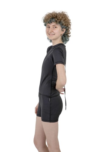 Black fitted swimsuit with binder-inspired chest panel – designed for confidence in the water